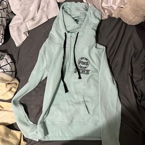 pink,Victoria secret sweater, teal with a hood and pocket.